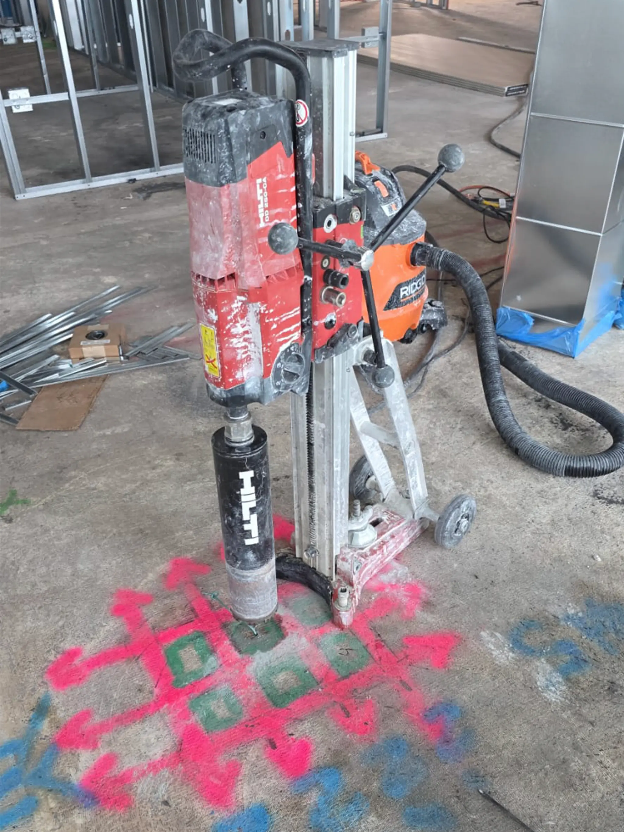 Core drilling operation on a concrete floor