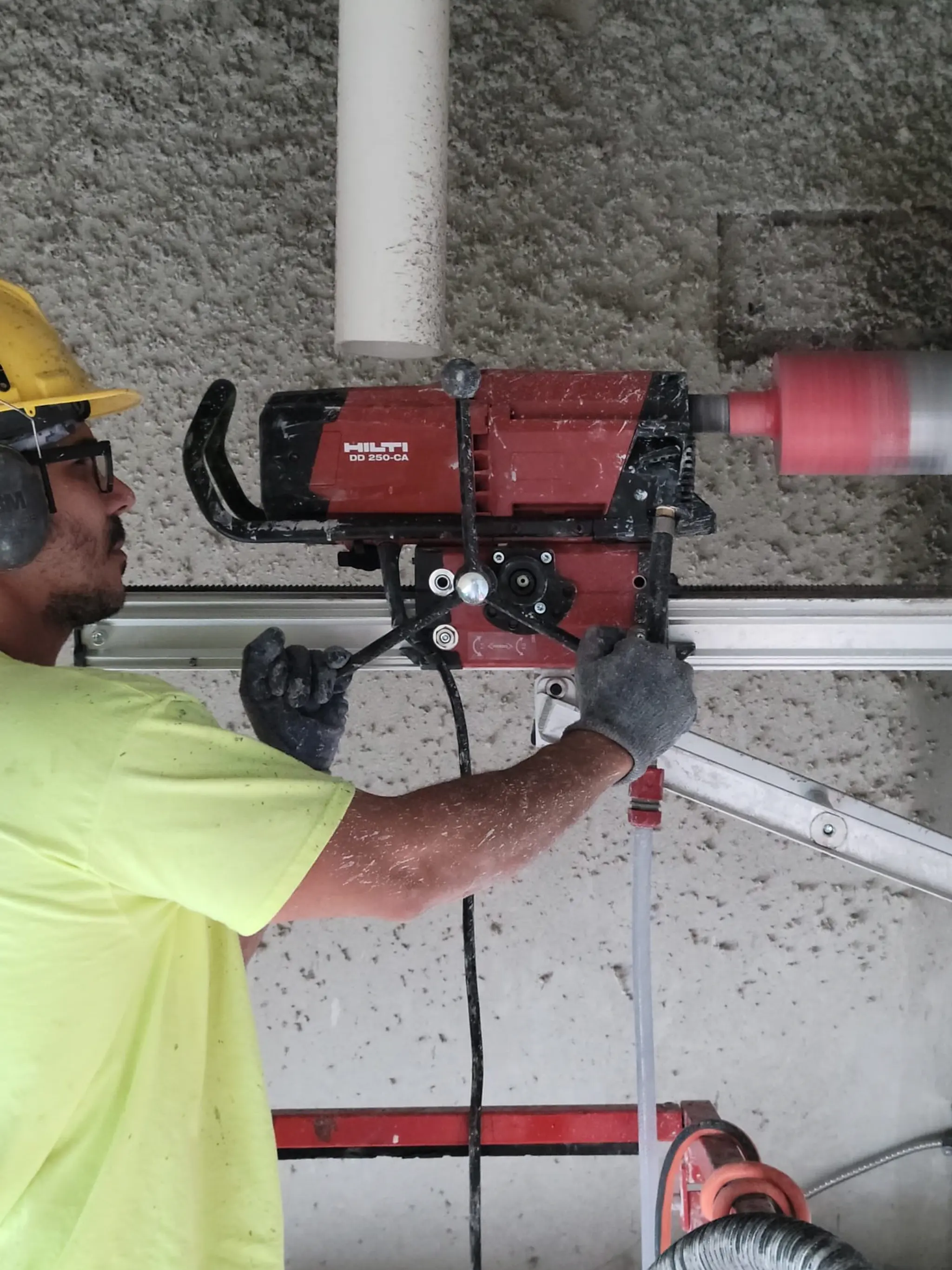 Core drilling setup on a concrete wall